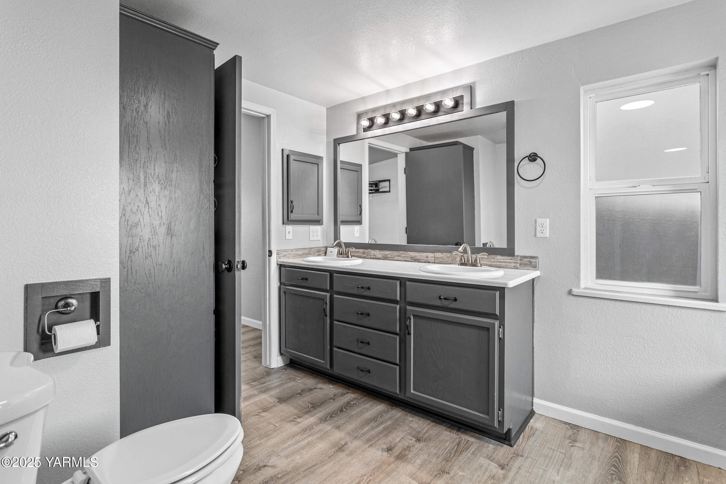 6000 Crestfields Road Yakima, WA 98903 - Photo 8 of 16 a bathroom with a sink vanity mirror and toilet
