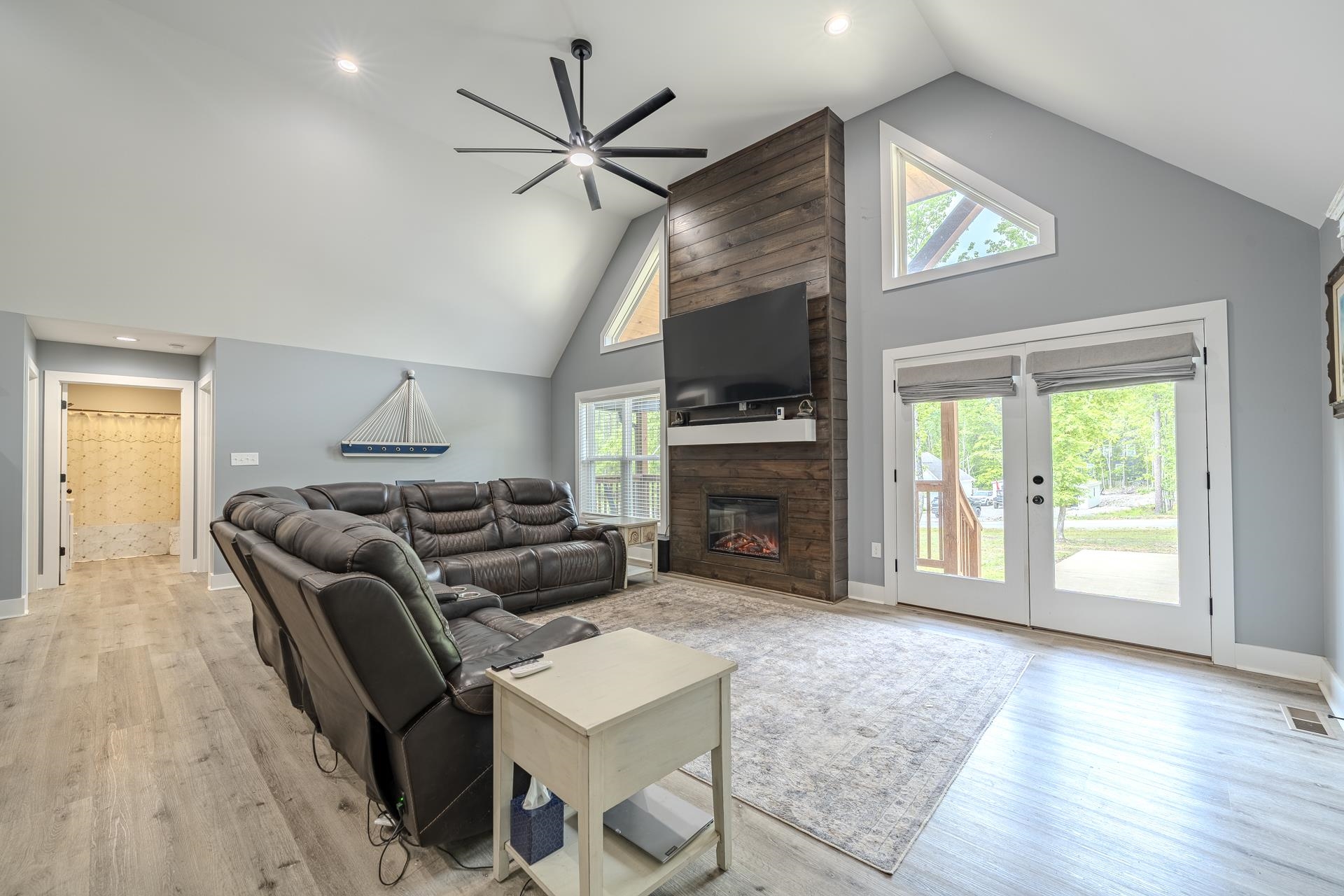 315 Timber Ridge Drive Counce, TN 38326 - Photo 8 of 40 a living room with furniture a fireplace and a flat screen tv
