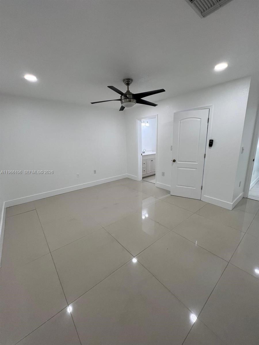 11320 Southwest 245th Street Homestead, FL 33032 - Photo 11 of 21 a view of a livingroom with a ceiling fan and window
