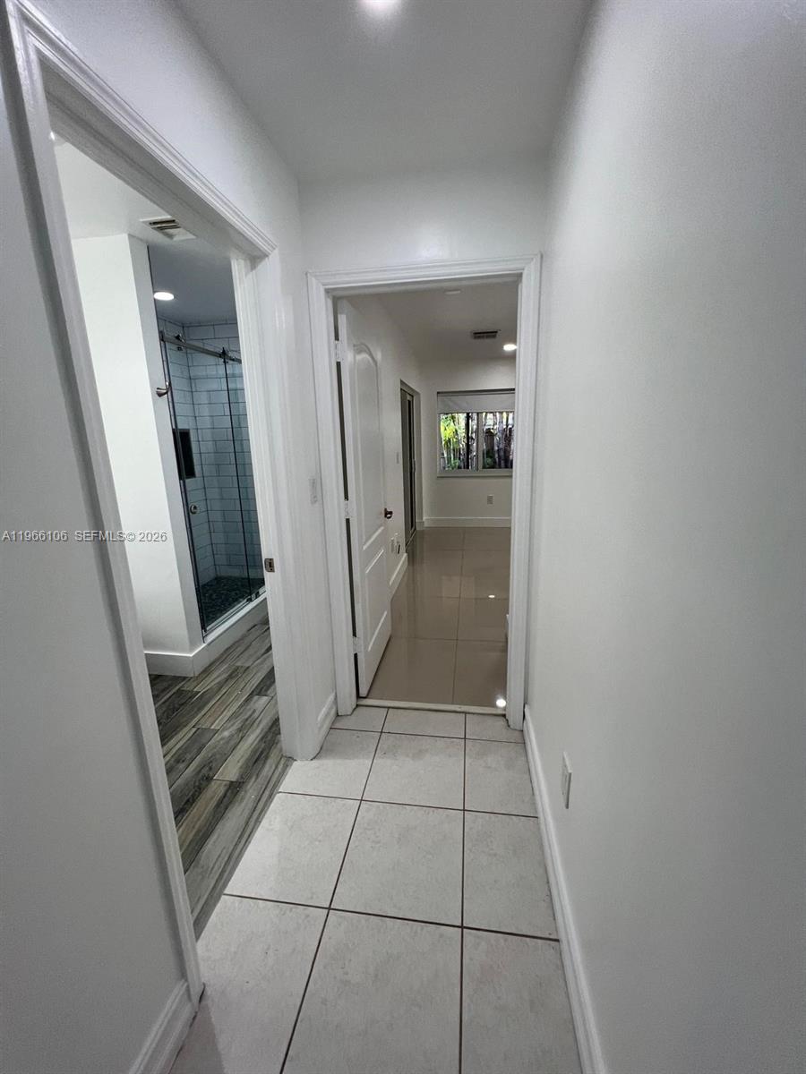 11320 Southwest 245th Street Homestead, FL 33032 - Photo 12 of 21 wooden floor in a hallway