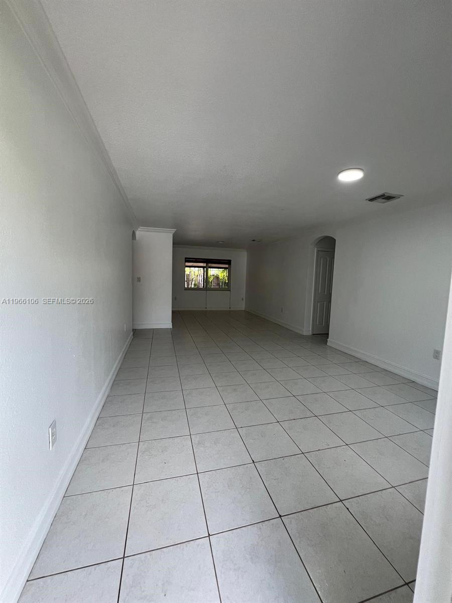 11320 Southwest 245th Street Homestead, FL 33032 - Photo 17 of 21 a view of an empty room with a window