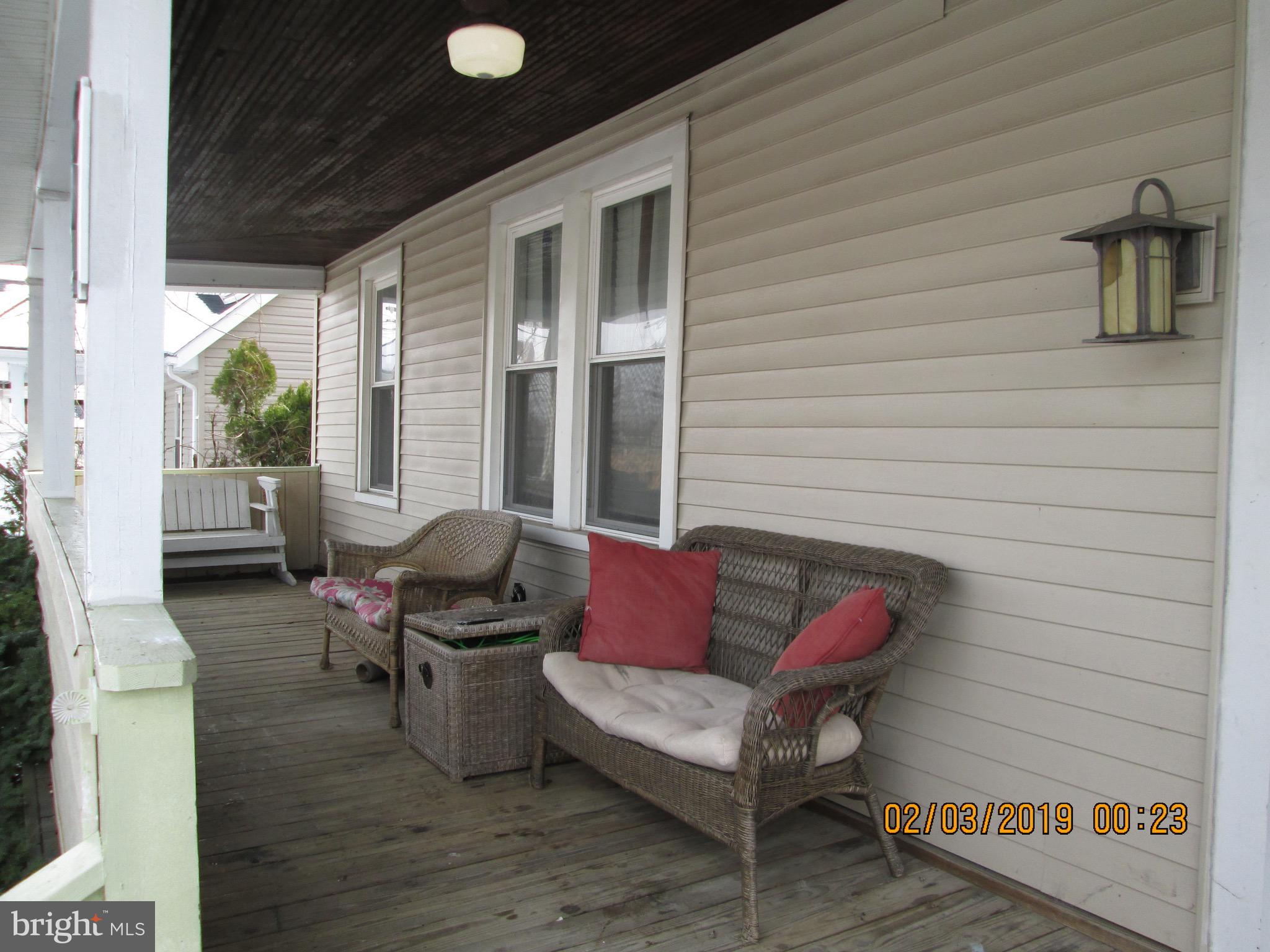 604 Orpington Road Baltimore, MD 21229 - Photo 9 of 9 Great front porch with a porch swing!