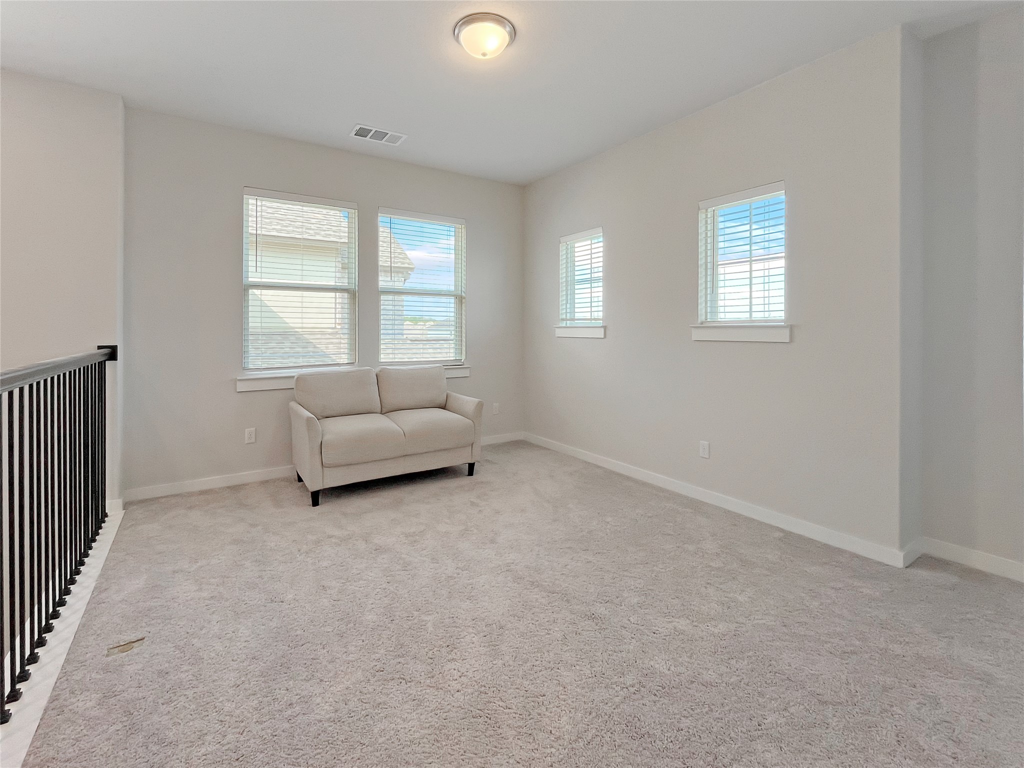 1200 Willie Rnch Way Leander, TX 78641 - Photo 12 of 25 Living area featuring light carpet and baseboards