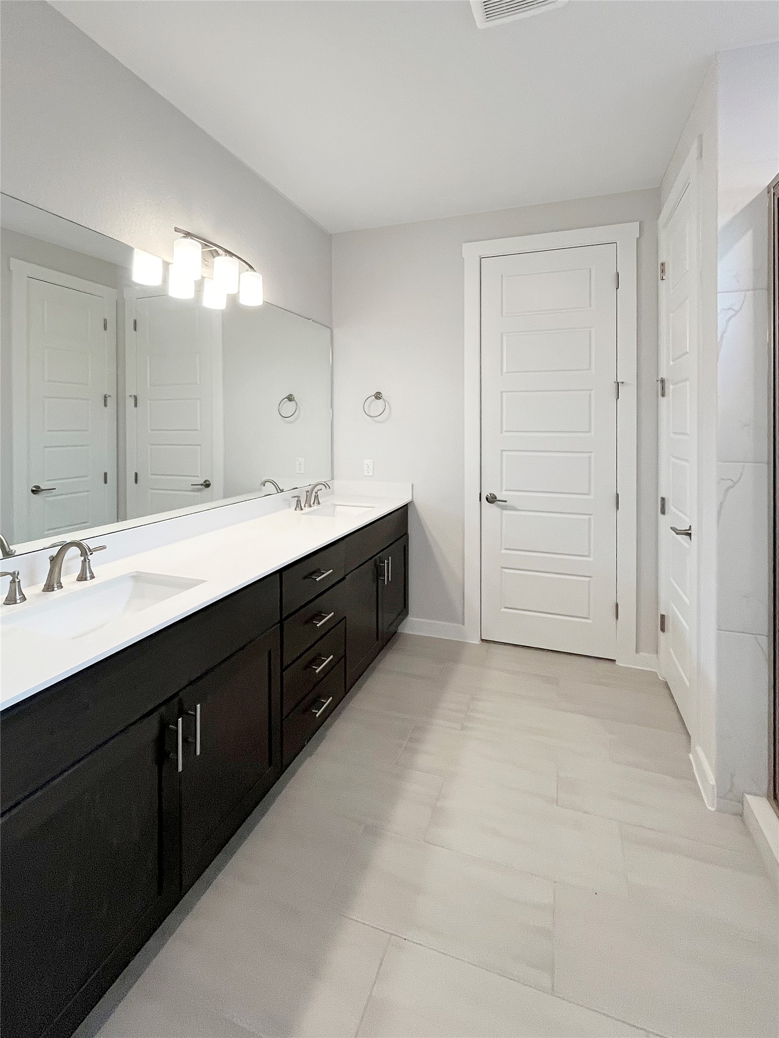 1200 Willie Rnch Way Leander, TX 78641 - Photo 16 of 25 Bathroom with double vanity and a shower with door