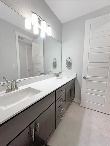 a bathroom with a shower and a glass door