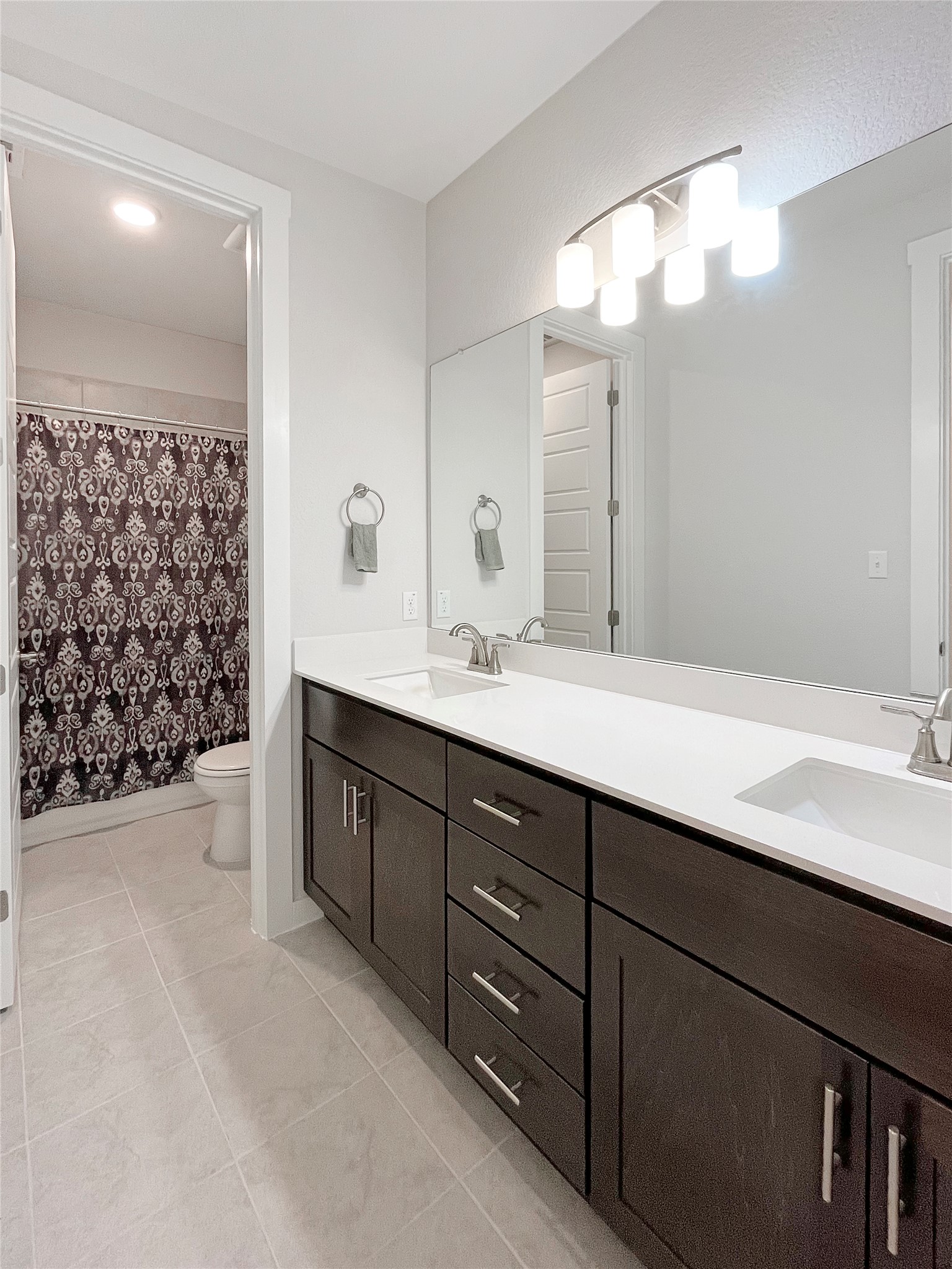 1200 Willie Rnch Way Leander, TX 78641 - Photo 19 of 25 Full bath featuring double vanity and light tile patterned floors