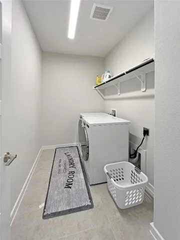 a bathroom with a double vanity sink mirror and shower