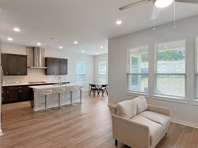 a spacious bedroom with a bed and a table