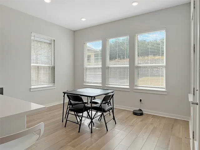 a living room with furniture and stairs