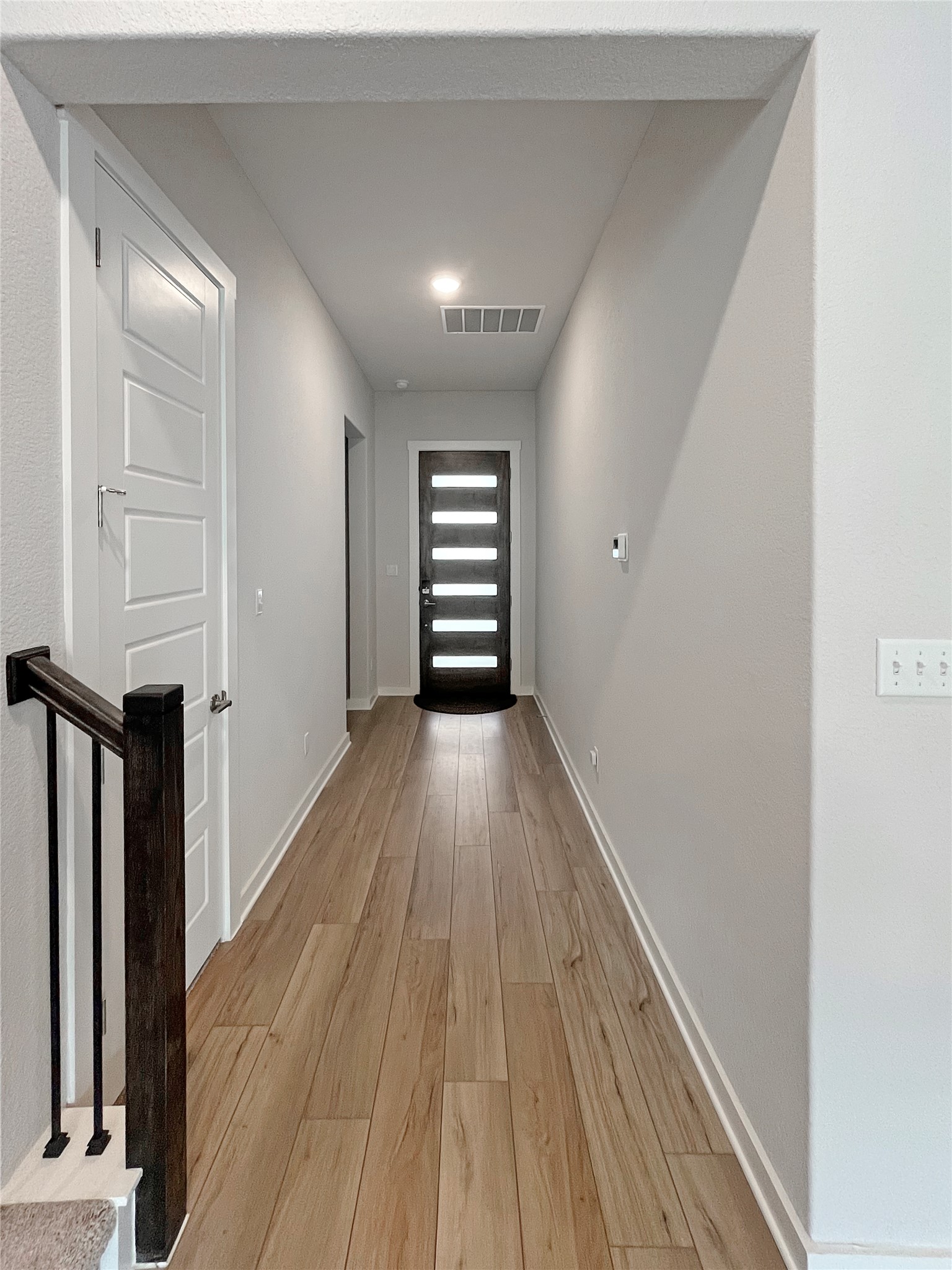 1200 Willie Rnch Way Leander, TX 78641 - Photo 9 of 25 Hall with light wood-style flooring and baseboards