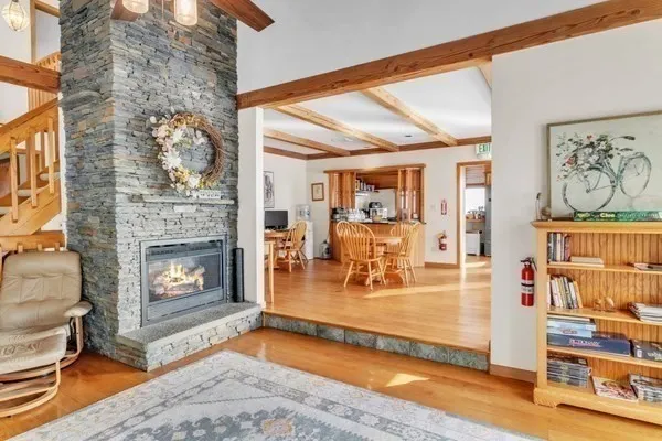 a view of a livingroom with furniture and a fireplace