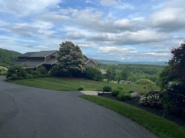151 Smead Hill Road Greenfield, MA 01301 - Photo 22 of 24 a view of a city street next to a yard