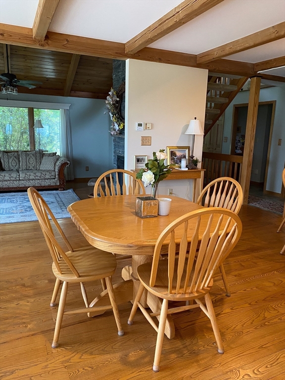 151 Smead Hill Road Greenfield, MA 01301 - Photo 4 of 24 a view of a dining room with furniture and wooden floor