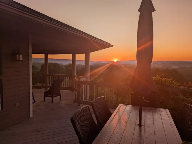 a view of a two chairs in the balcony