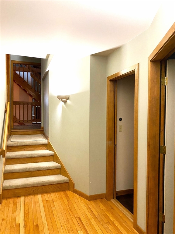 151 Smead Hill Road Greenfield, MA 01301 - Photo 8 of 24 a view of bedroom with wooden floor and stairs