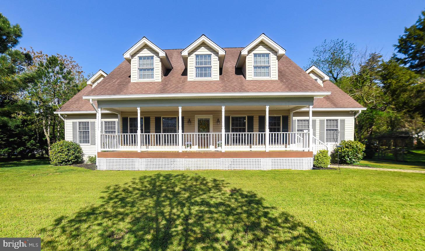 13425 Olivet Road Lusby, MD 20657 - Photo 1 of 59 a front view of a house with a yard and potted plants