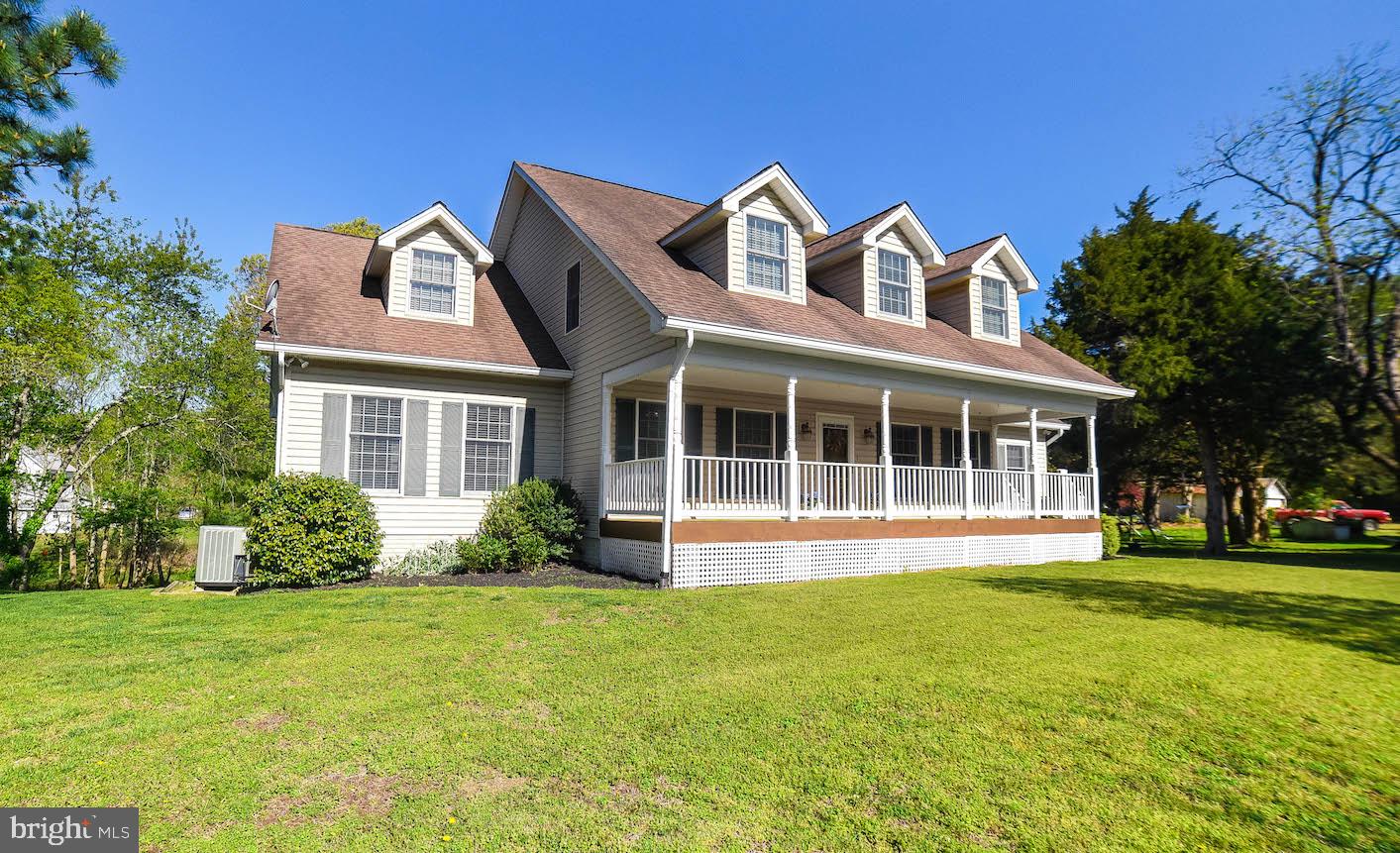 13425 Olivet Road Lusby, MD 20657 - Photo 2 of 59 a front view of a house with a yard