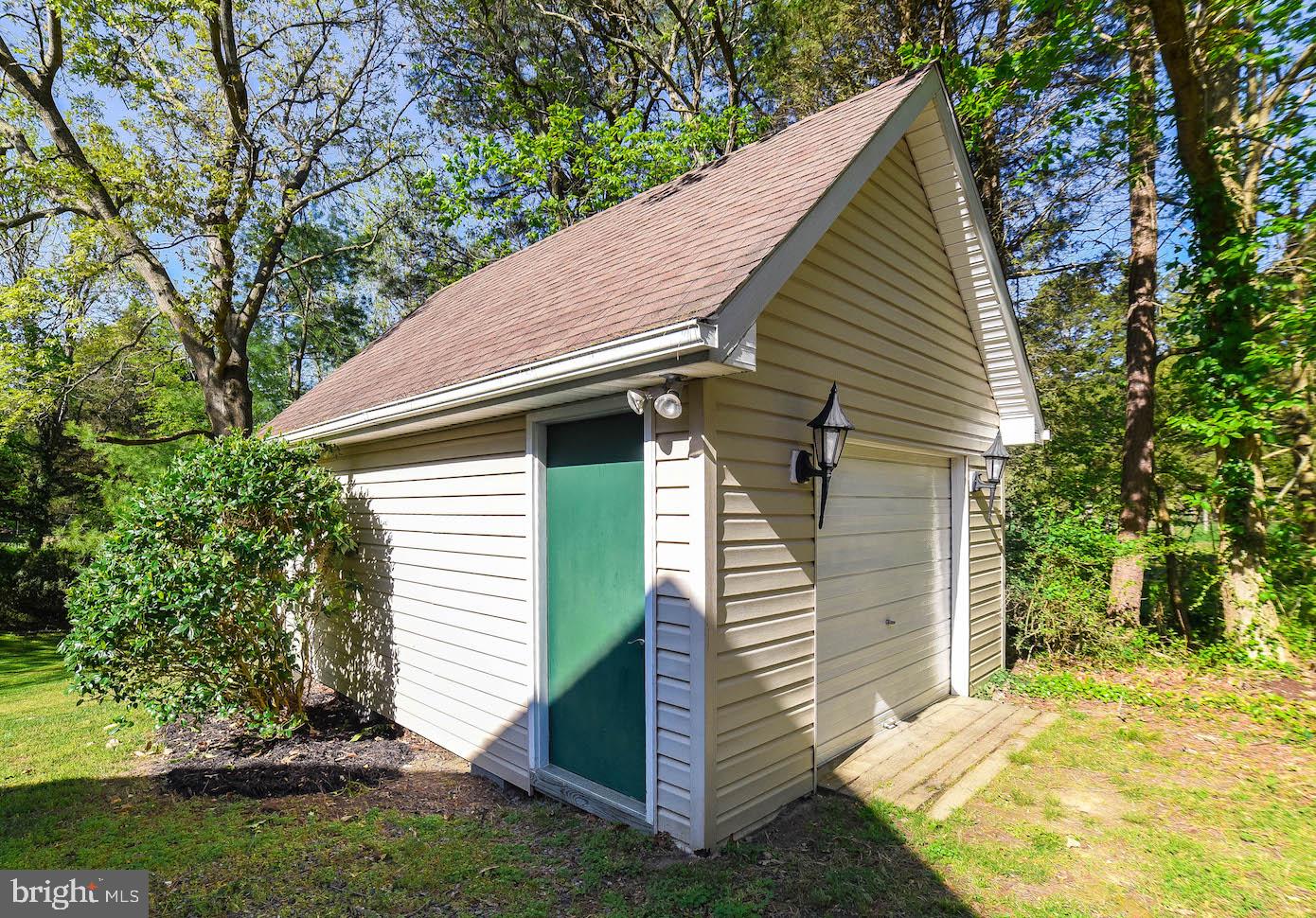 13425 Olivet Road Lusby, MD 20657 - Photo 16 of 59 a view of small house with yard and plants