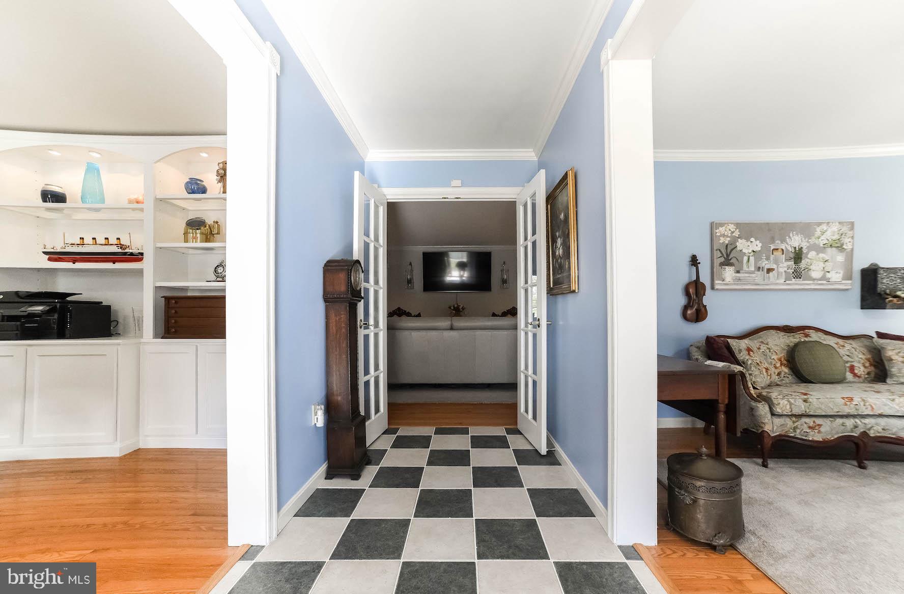 13425 Olivet Road Lusby, MD 20657 - Photo 17 of 59 a hallway with a couch and a view of living room