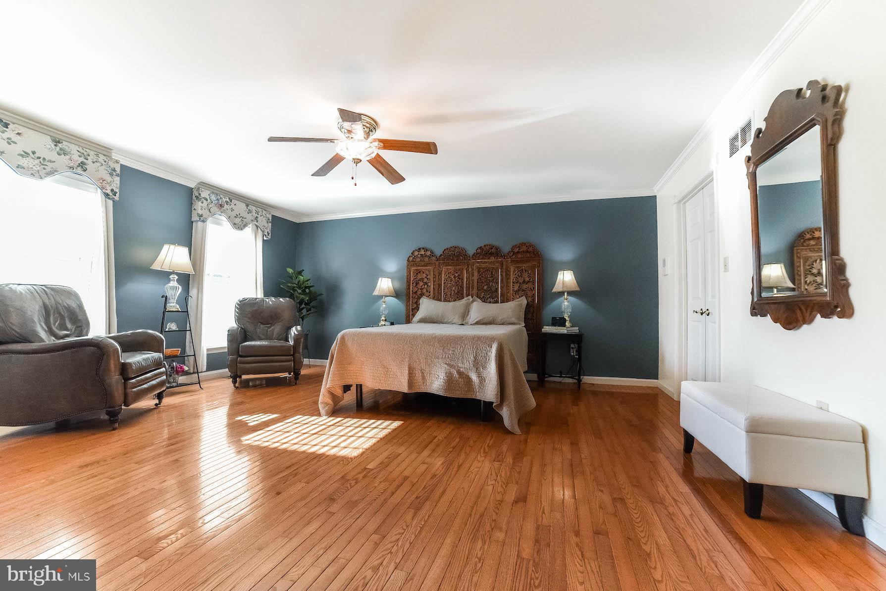 13425 Olivet Road Lusby, MD 20657 - Photo 25 of 59 a bedroom with furniture and wooden floor