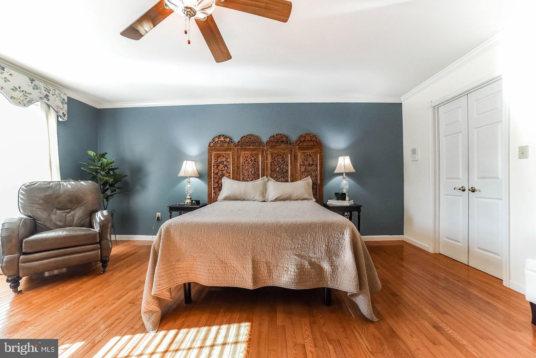 13425 Olivet Road Lusby, MD 20657 - Photo 27 of 59 a bedroom with a bed and wooden floor
