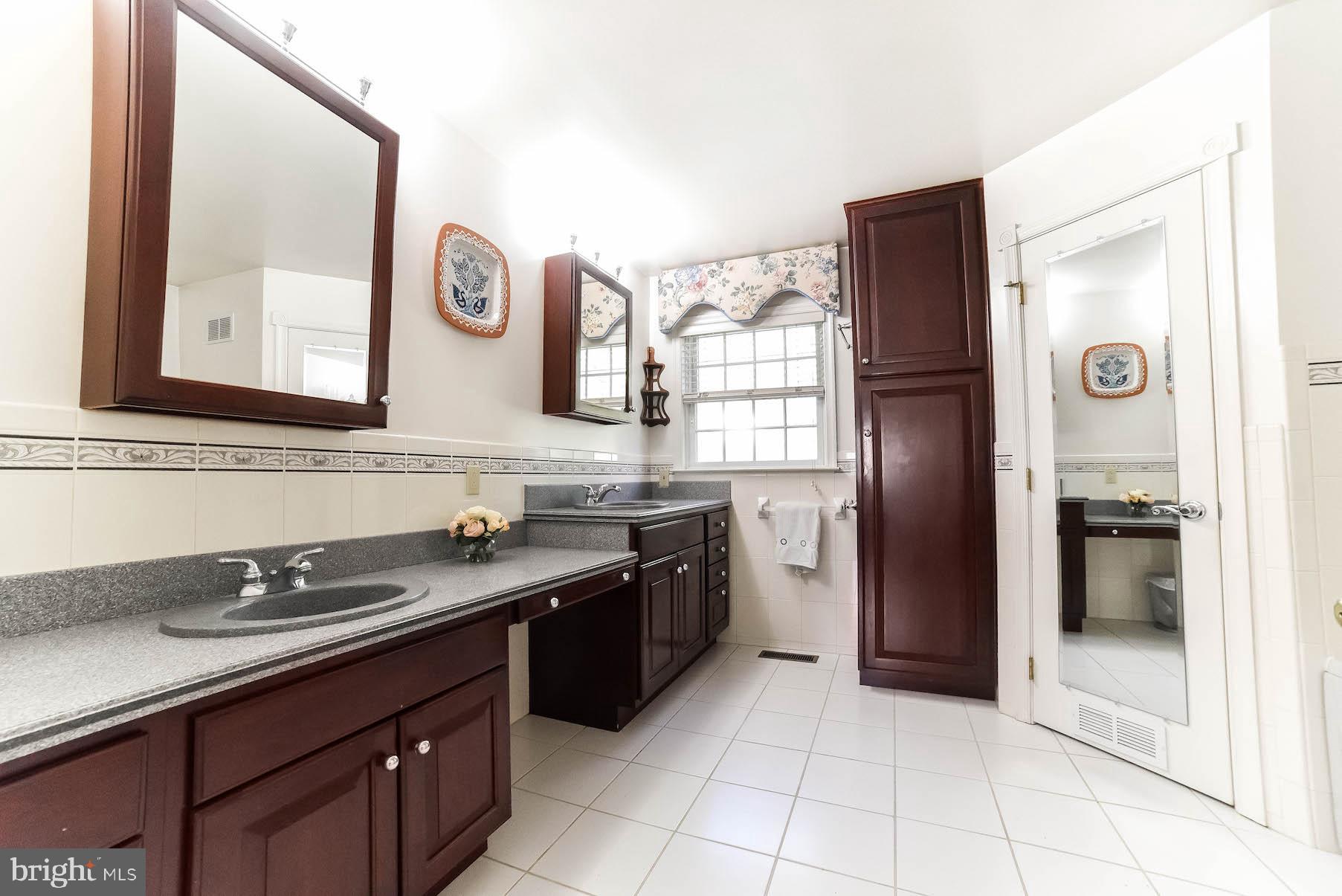 13425 Olivet Road Lusby, MD 20657 - Photo 29 of 59 a kitchen with a sink and a refrigerator