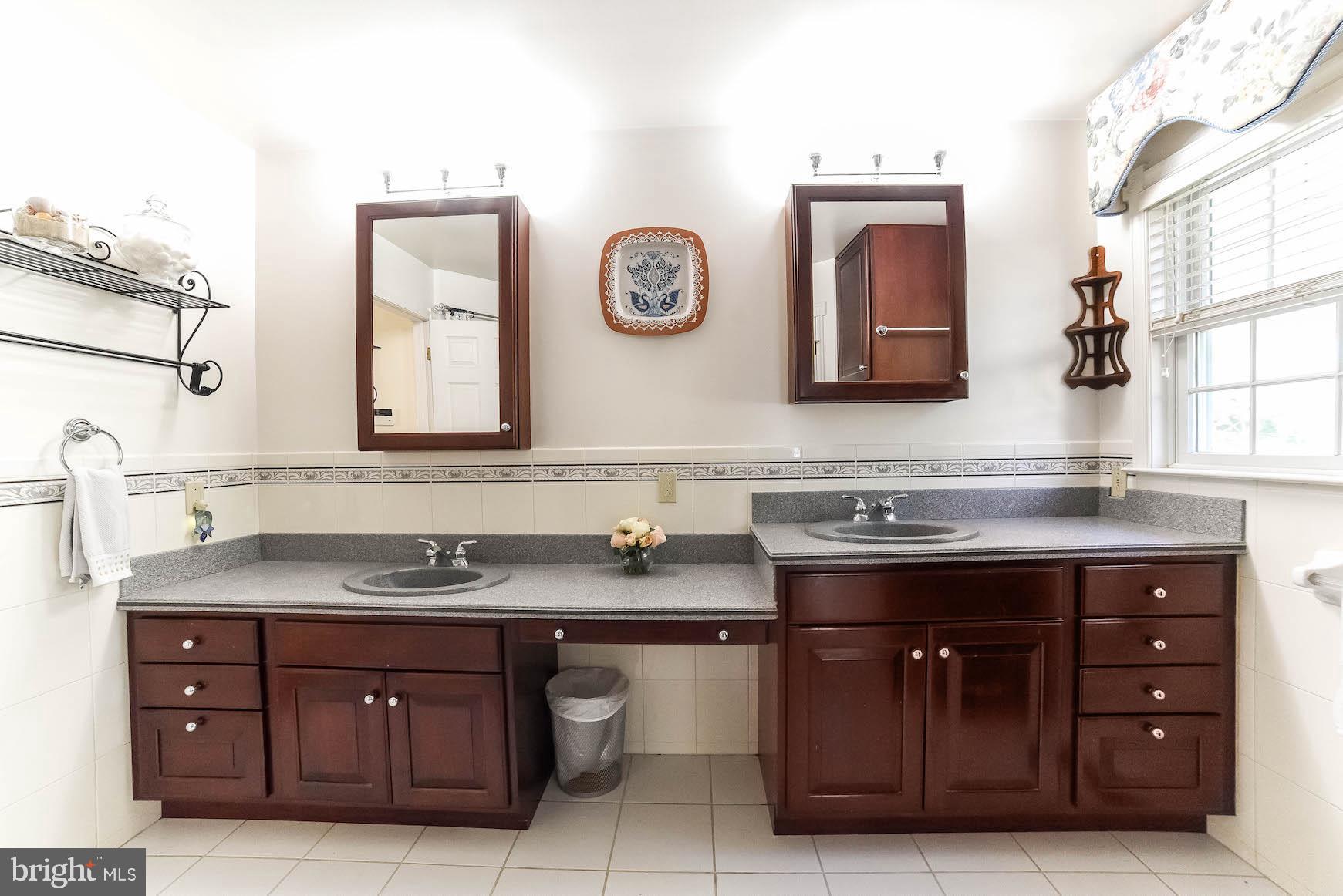 13425 Olivet Road Lusby, MD 20657 - Photo 30 of 59 a bathroom with a granite countertop sink and a mirror