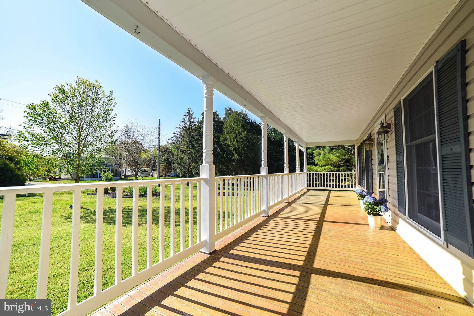 13425 Olivet Road Lusby, MD 20657 - Photo 4 of 59 a view of balcony with wooden floor and fence