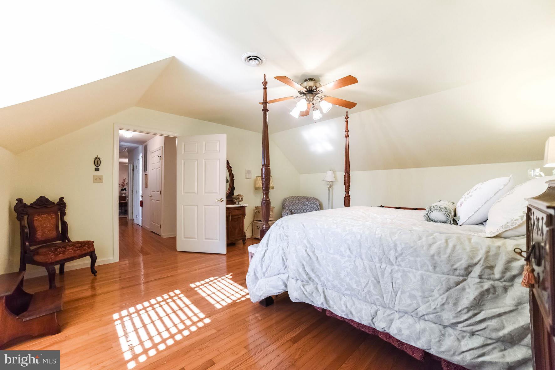 13425 Olivet Road Lusby, MD 20657 - Photo 48 of 59 a bedroom with a bed and a chandelier