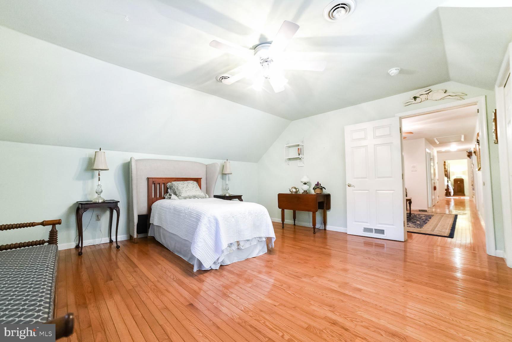 13425 Olivet Road Lusby, MD 20657 - Photo 53 of 59 a bedroom with a bed and a chandelier