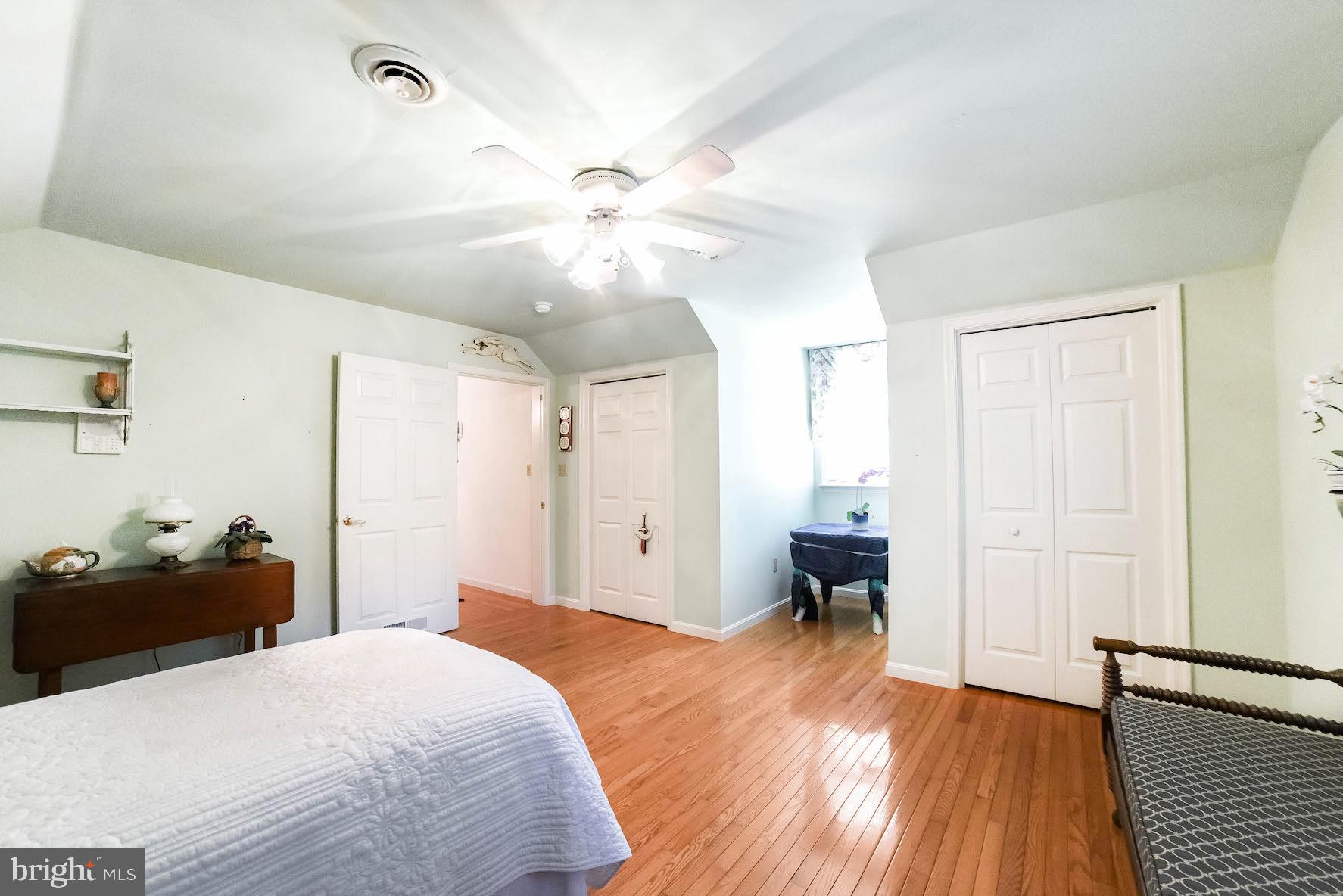 13425 Olivet Road Lusby, MD 20657 - Photo 55 of 59 a bedroom with a bed and a chandelier