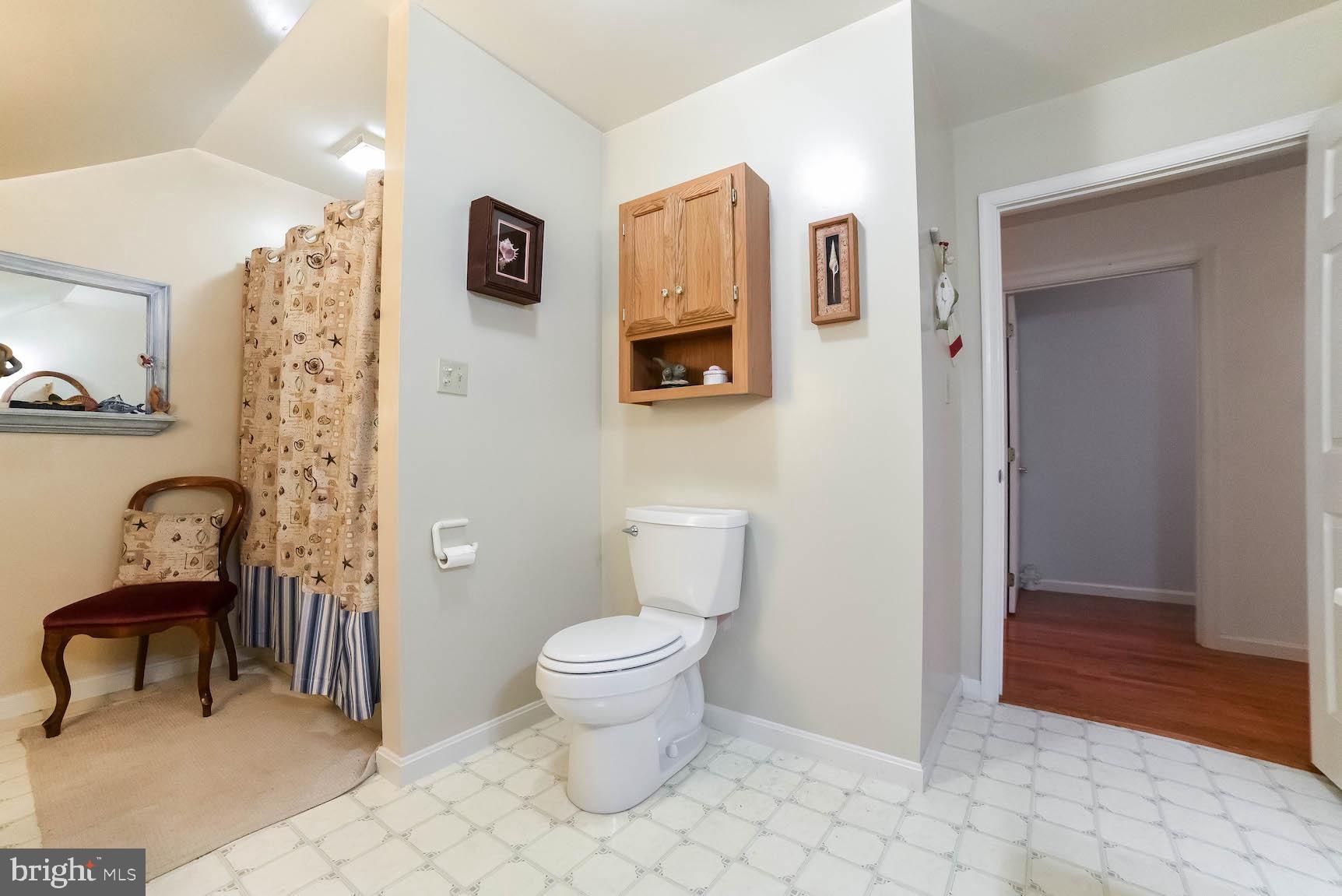 13425 Olivet Road Lusby, MD 20657 - Photo 57 of 59 a bathroom with a toilet and a shower