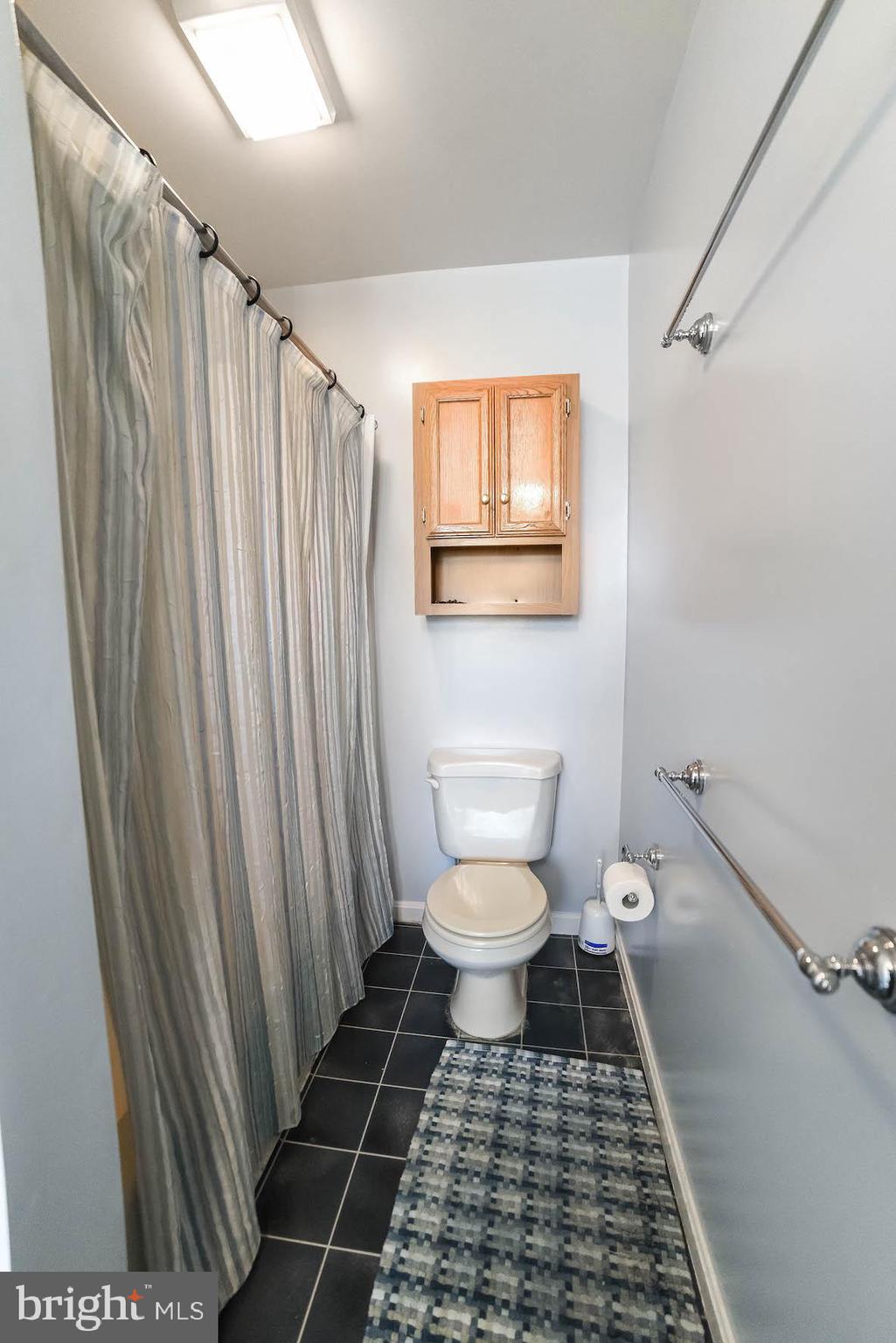 13425 Olivet Road Lusby, MD 20657 - Photo 59 of 59 a bathroom with a toilet and a shower