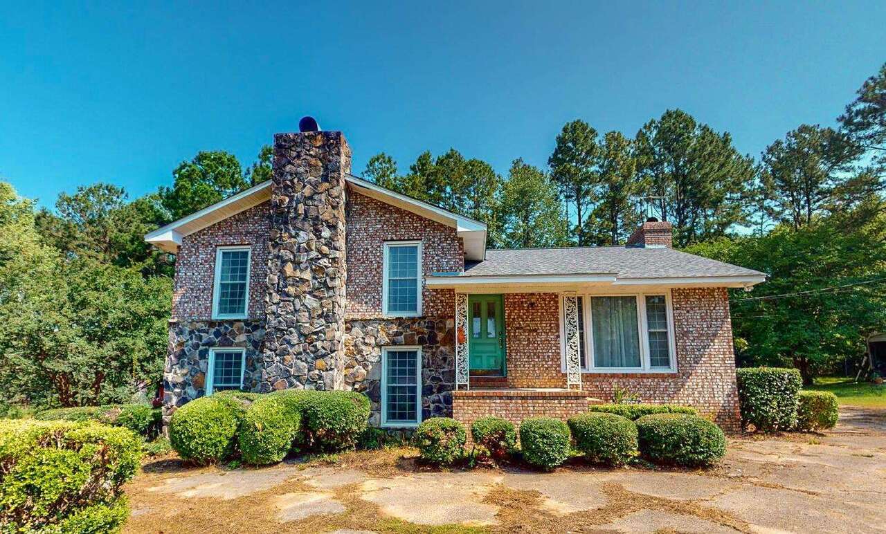 124 Carter Road Thomasville, GA 31792 - Photo 1 of 1 a front view of a house with a yard