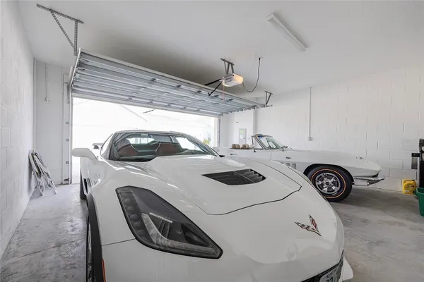 a room with a bed and a chandelier