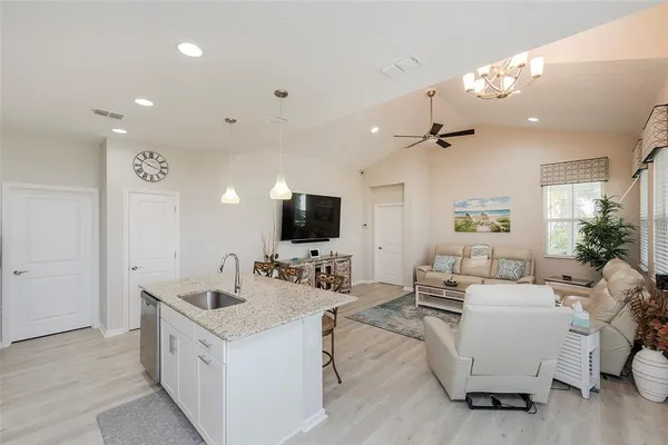 a view of living room with granite countertop furniture and fireplace