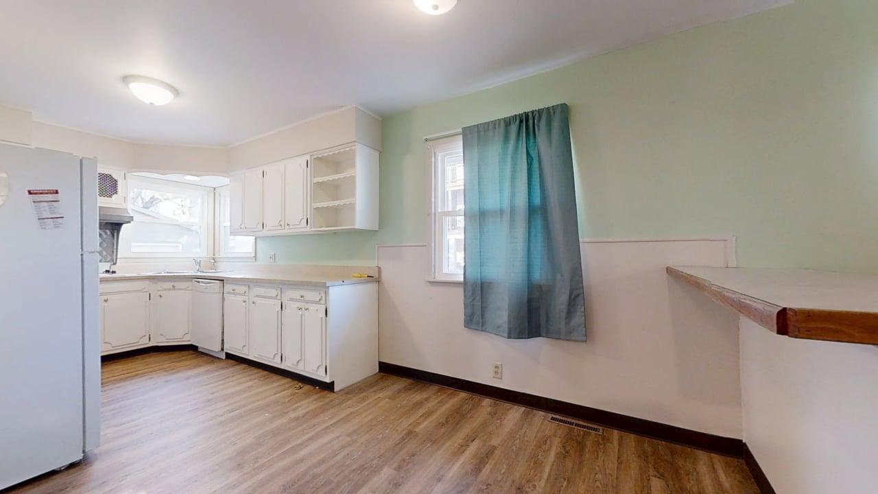 915 Morgan Street Normal, IL 61761 - Photo 11 of 43 a view of a kitchen with wooden floor and electronic appliances