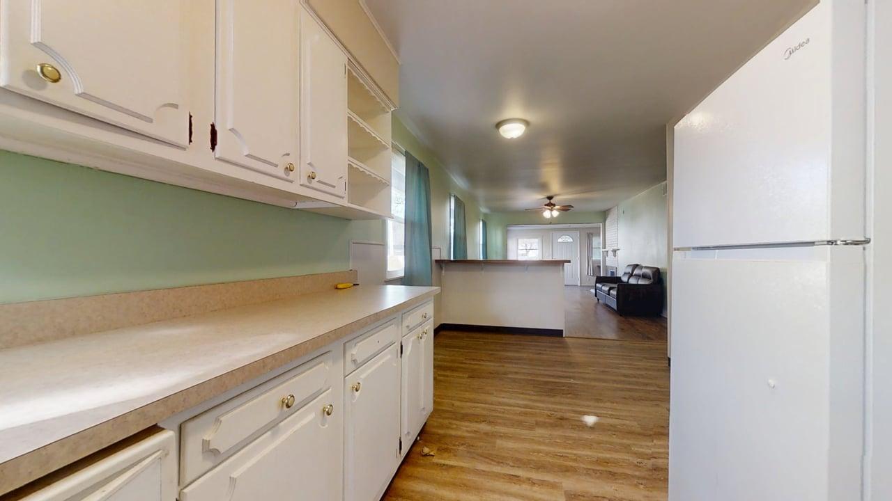 915 Morgan Street Normal, IL 61761 - Photo 13 of 43 a kitchen with a refrigerator and window