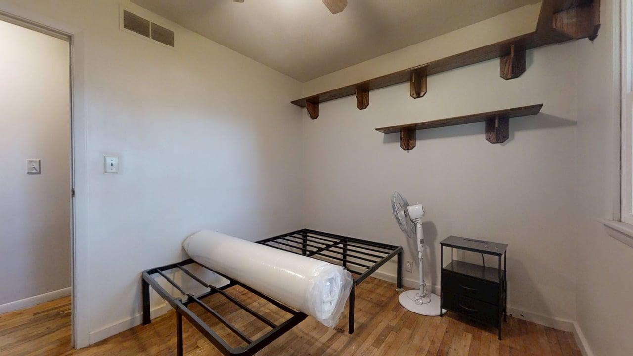 915 Morgan Street Normal, IL 61761 - Photo 19 of 43 a view of an empty room with wooden floor