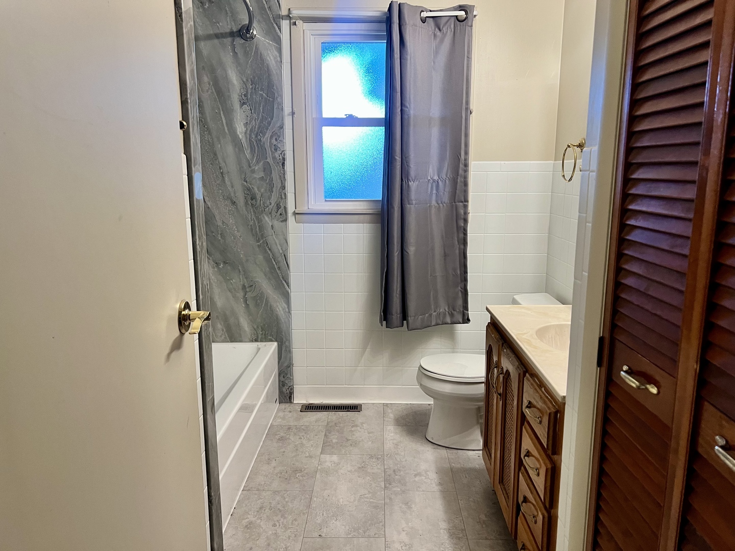 915 Morgan Street Normal, IL 61761 - Photo 24 of 43 a bathroom with a toilet a sink and a shower