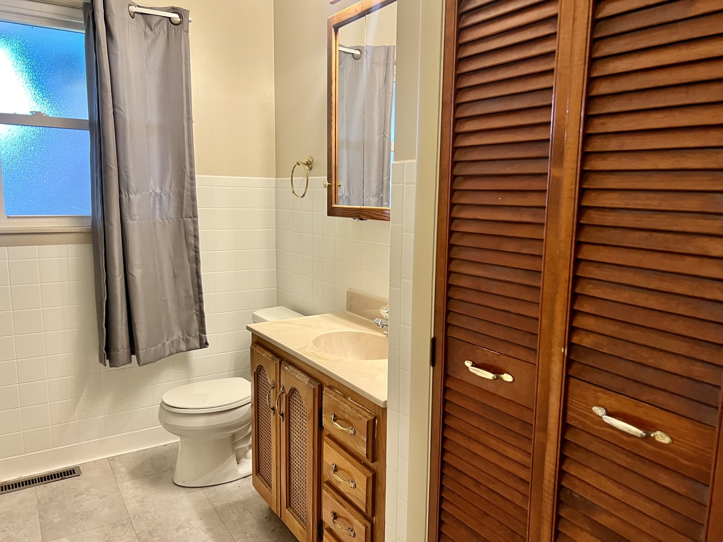 915 Morgan Street Normal, IL 61761 - Photo 25 of 43 a bathroom with a granite countertop sink toilet and shower