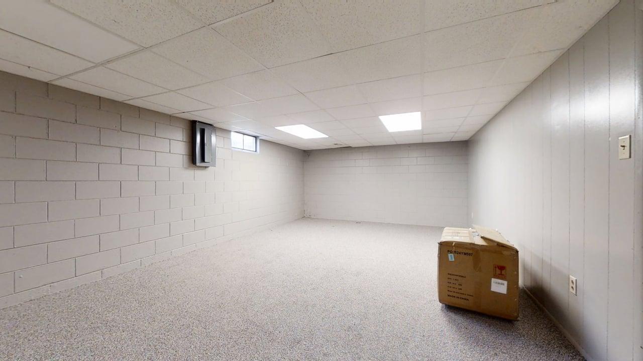 915 Morgan Street Normal, IL 61761 - Photo 27 of 43 a view of a livingroom with a projector