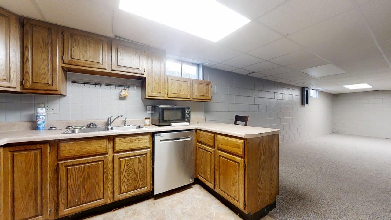 915 Morgan Street Normal, IL 61761 - Photo 33 of 43 a kitchen with cabinets a sink and appliances