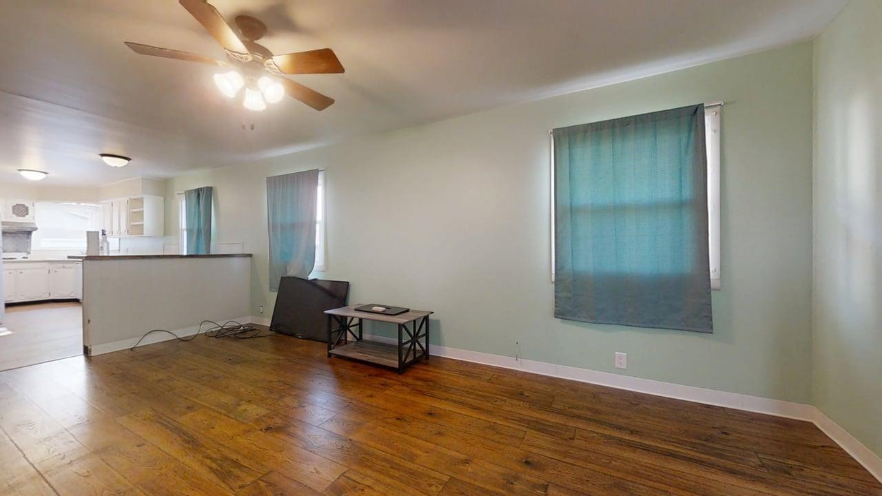 915 Morgan Street Normal, IL 61761 - Photo 8 of 43 a living room with furniture and a wooden floor