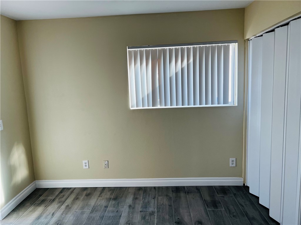 12771 Ponderosa Ranch Road Victorville, CA 92392 - Photo 11 of 23 a view of a room with wooden floor