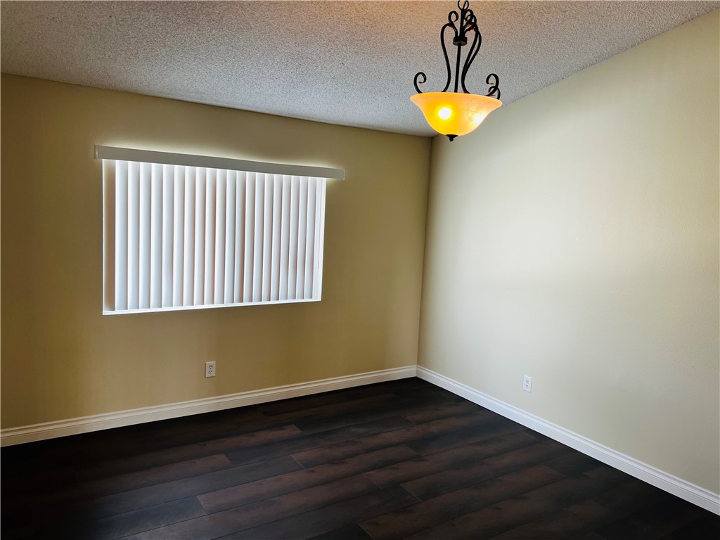 12771 Ponderosa Ranch Road Victorville, CA 92392 - Photo 18 of 23 a view of empty room with a window and lamps