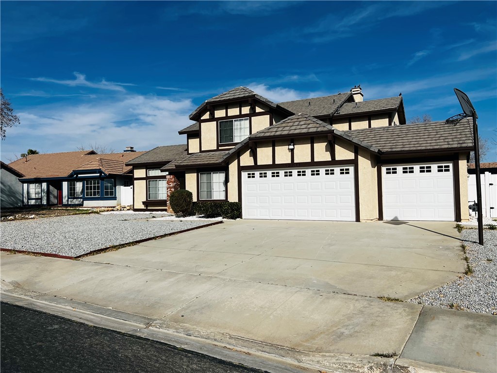 12771 Ponderosa Ranch Road Victorville, CA 92392 - Photo 2 of 23 a front view of a house with a yard