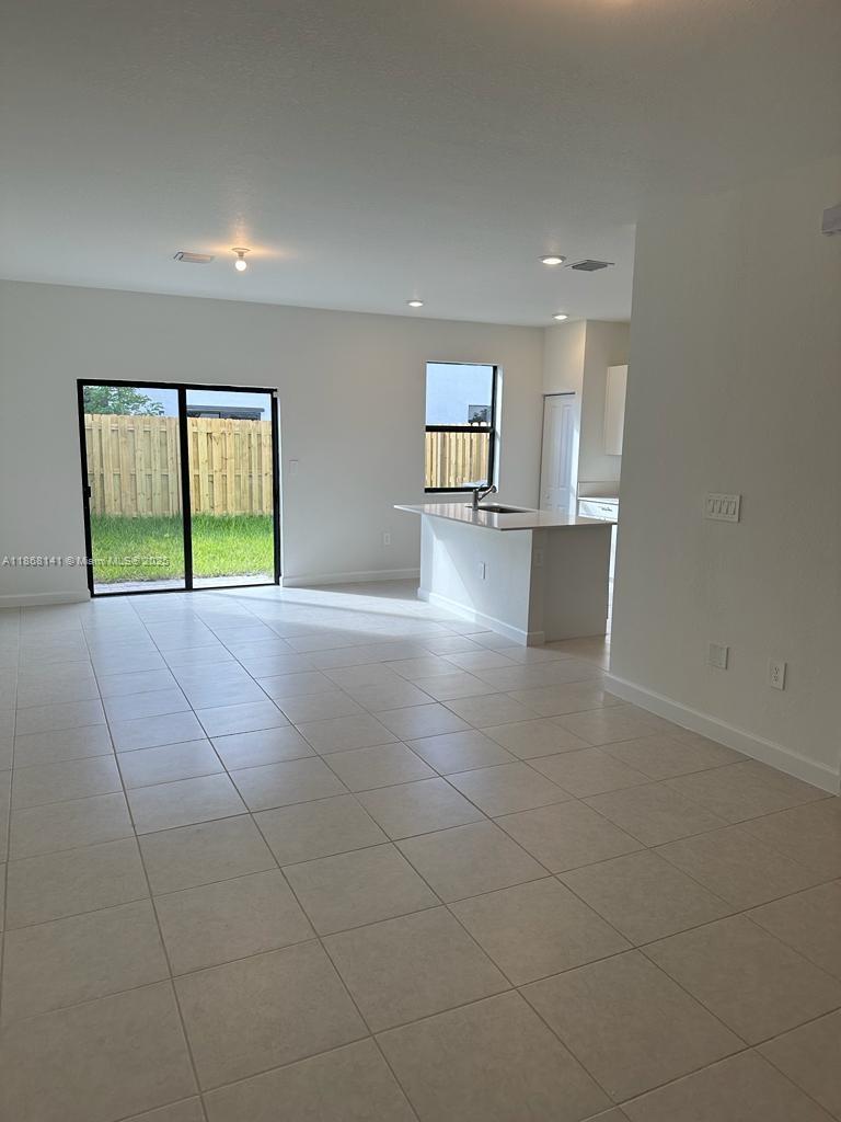 11926 Southwest 245 Terrace Homestead, FL 33032 - Photo 15 of 43 a view of an empty room with a window