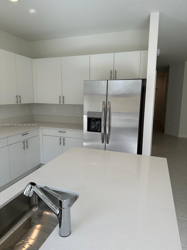 11926 Southwest 245 Terrace Homestead, FL 33032 - Photo 17 of 43 a room with a fireplace and cabinets