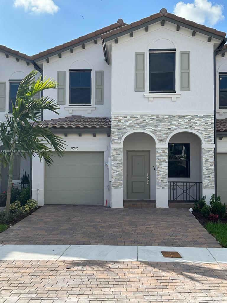 11926 Southwest 245 Terrace Homestead, FL 33032 - Photo 2 of 43 a front view of a house with yard